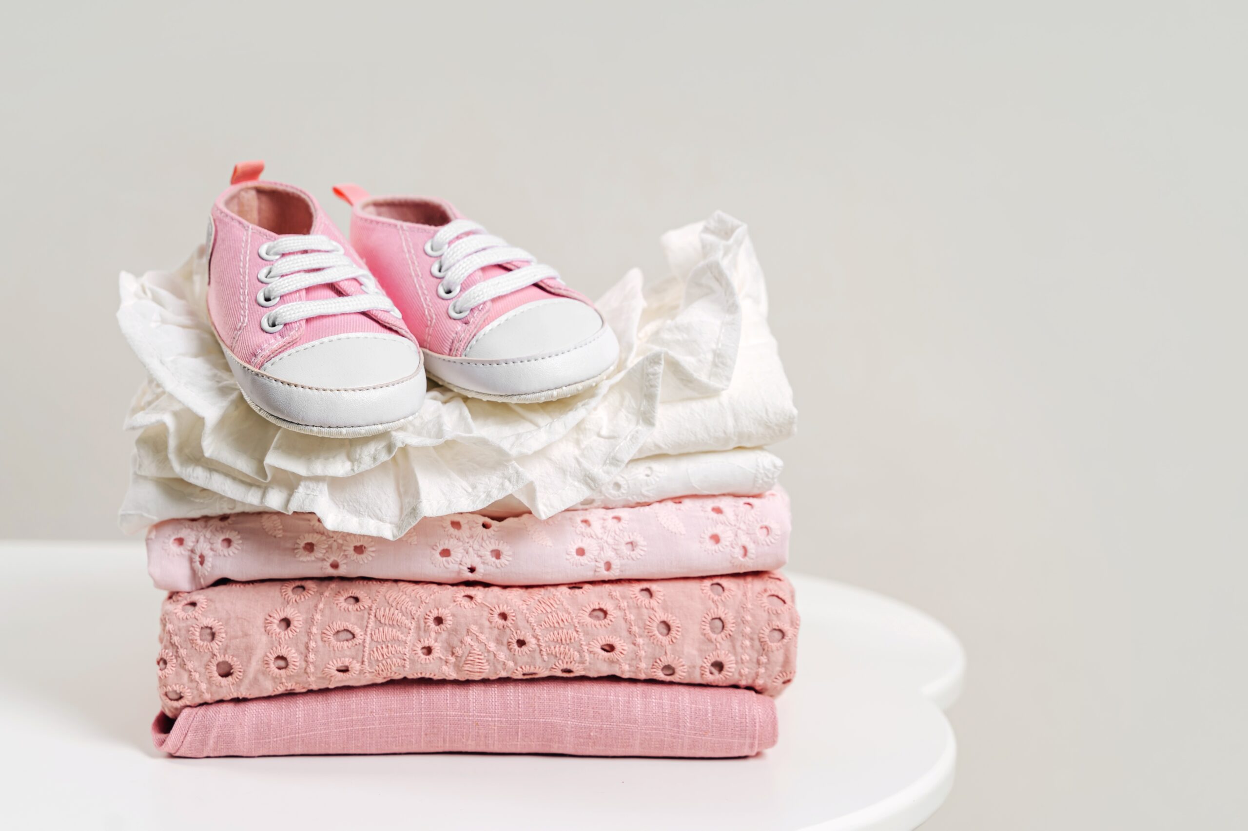 Pile of folded baby clothes for storage