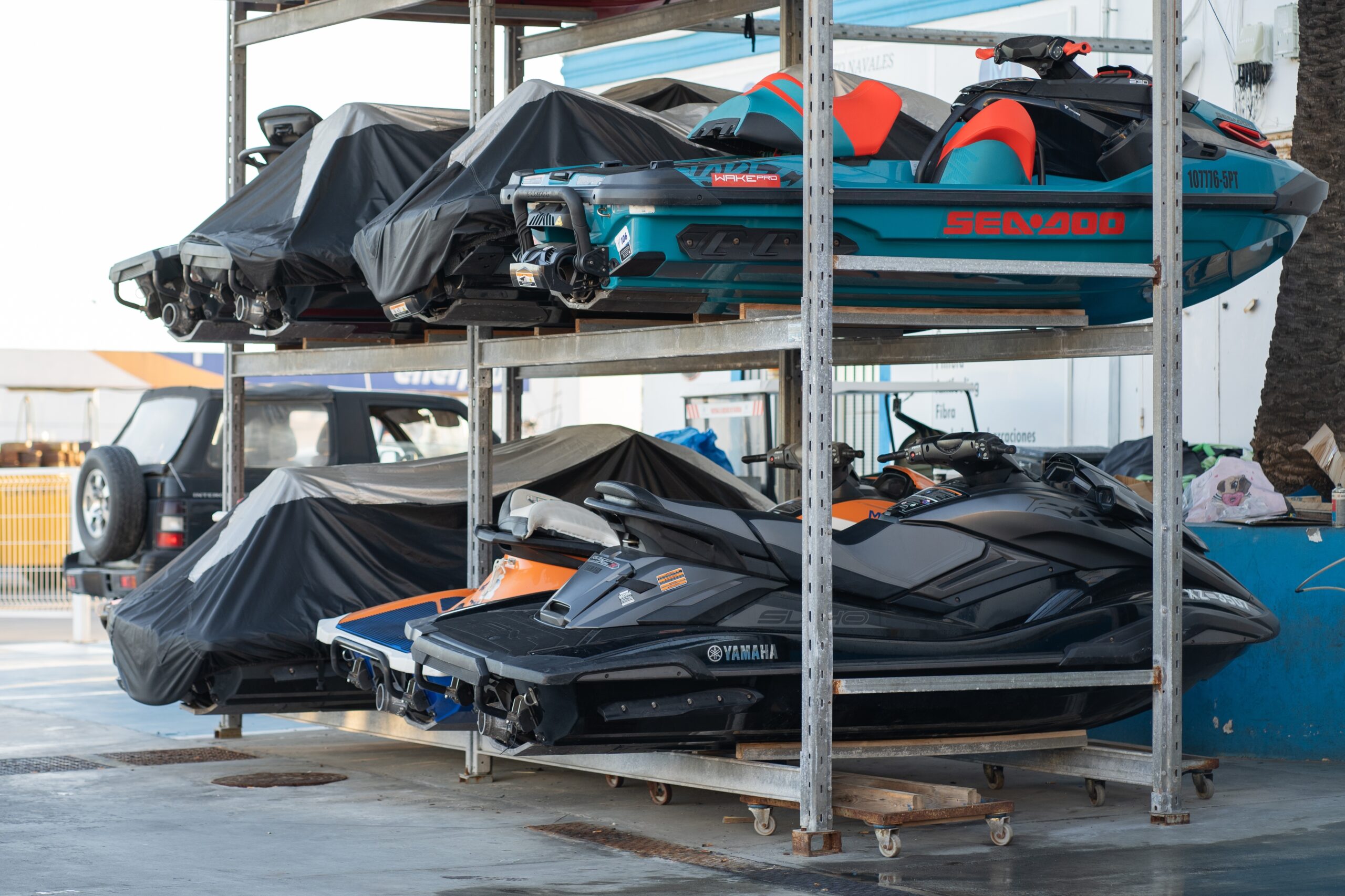 Several jetskis stored outdoors