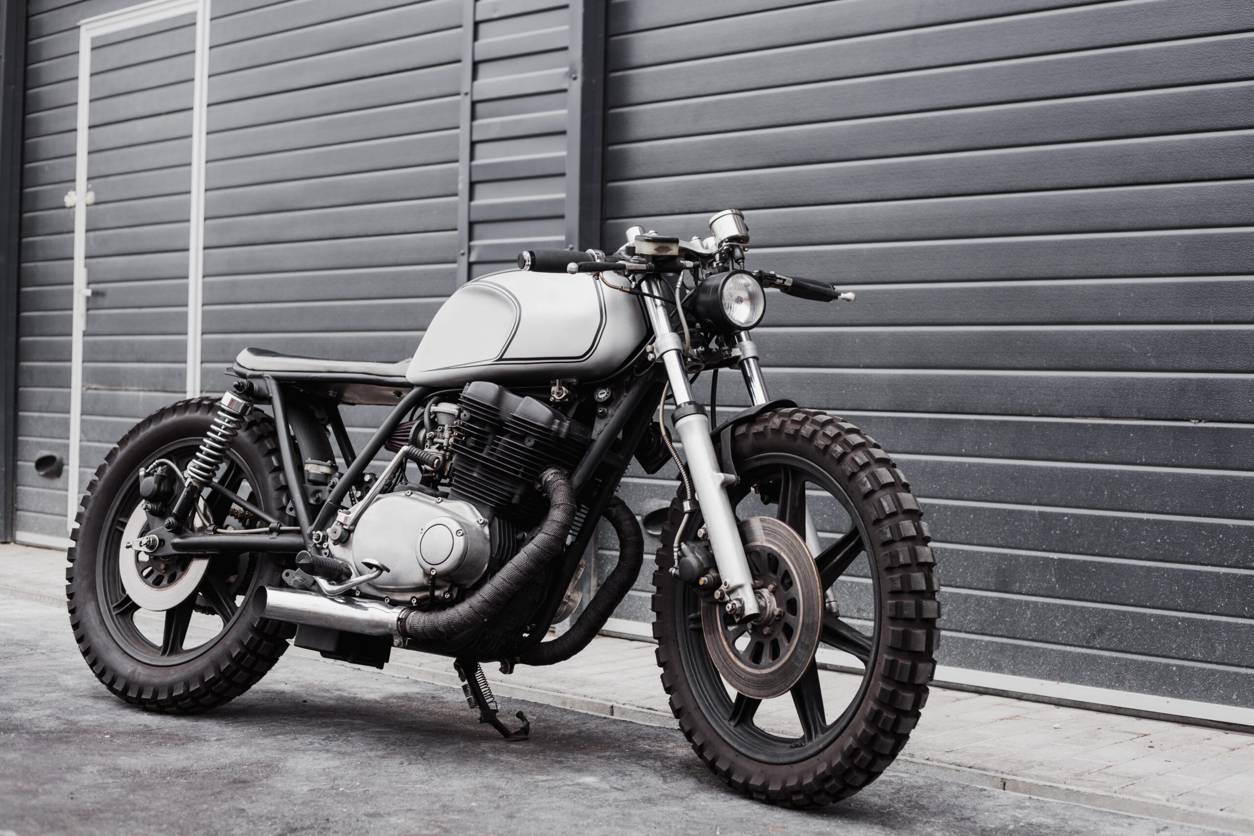Motorcycle parked in front of storage units