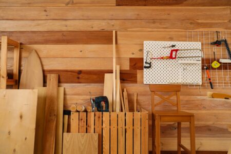Woodworking workshop storage ideas with pegboards, lumber storage, and tools