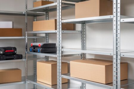 Metal shelf units with cardboard boxes