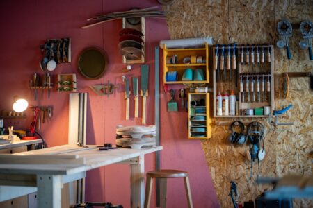 Wall-mounted plywood with vertical storage as workshop storage ideas