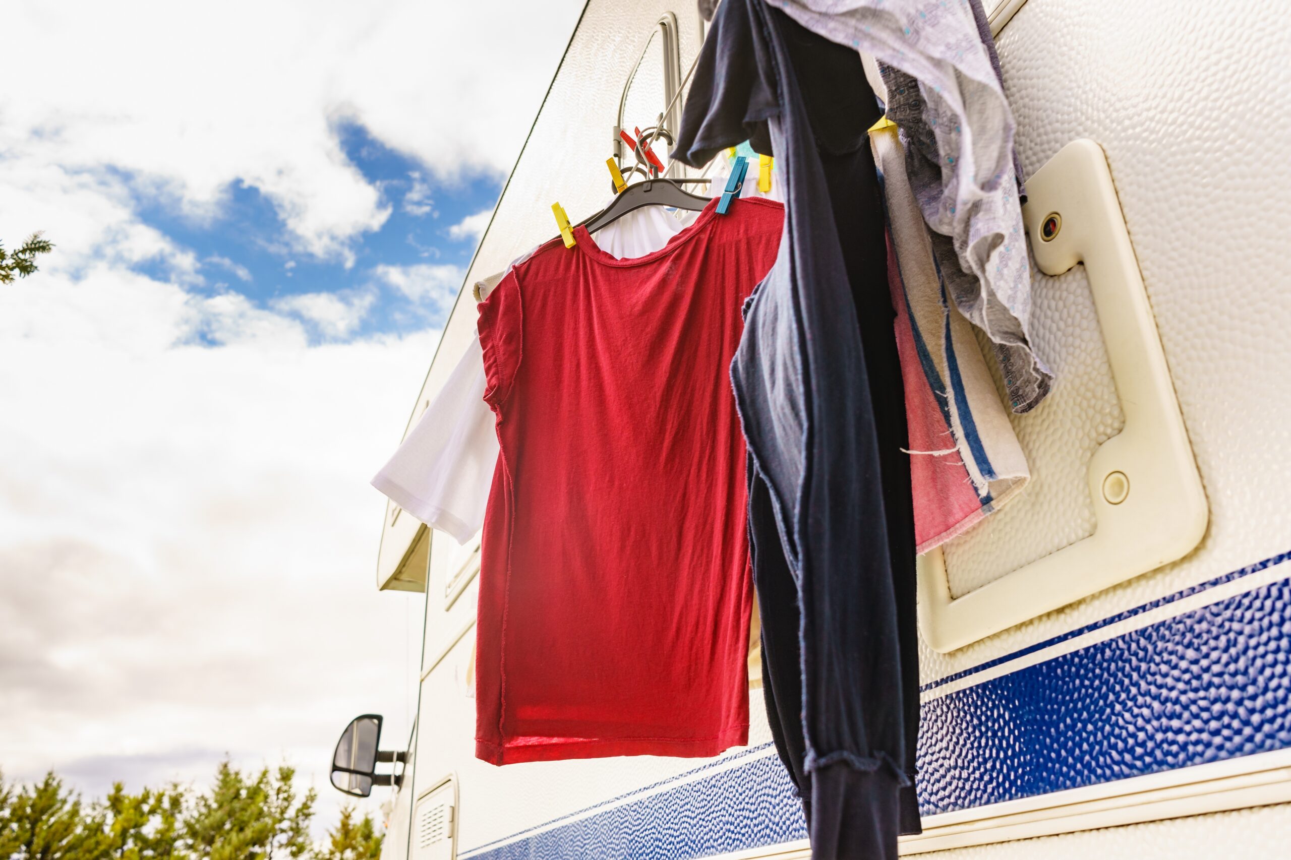 Clothes hanging to dry on clothesline outside of an RV