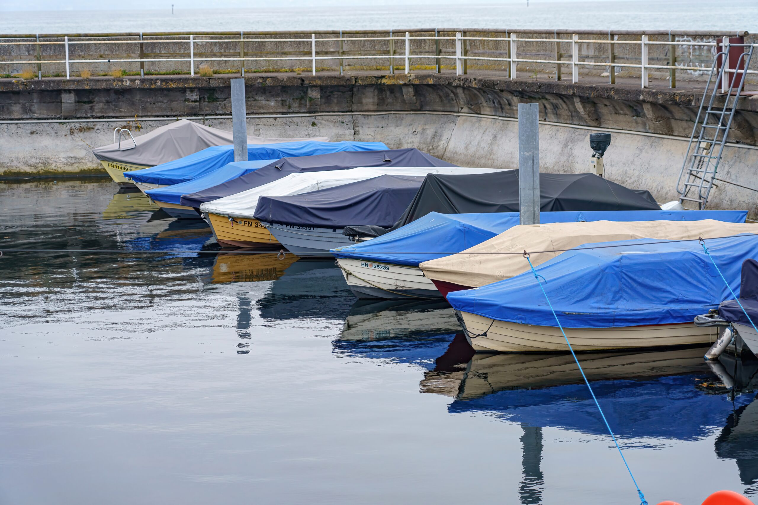 Row of boats parked at a pier