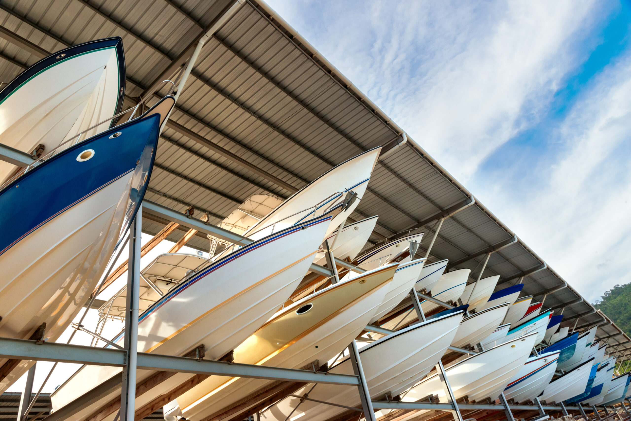 Row of boats parked in covered storage