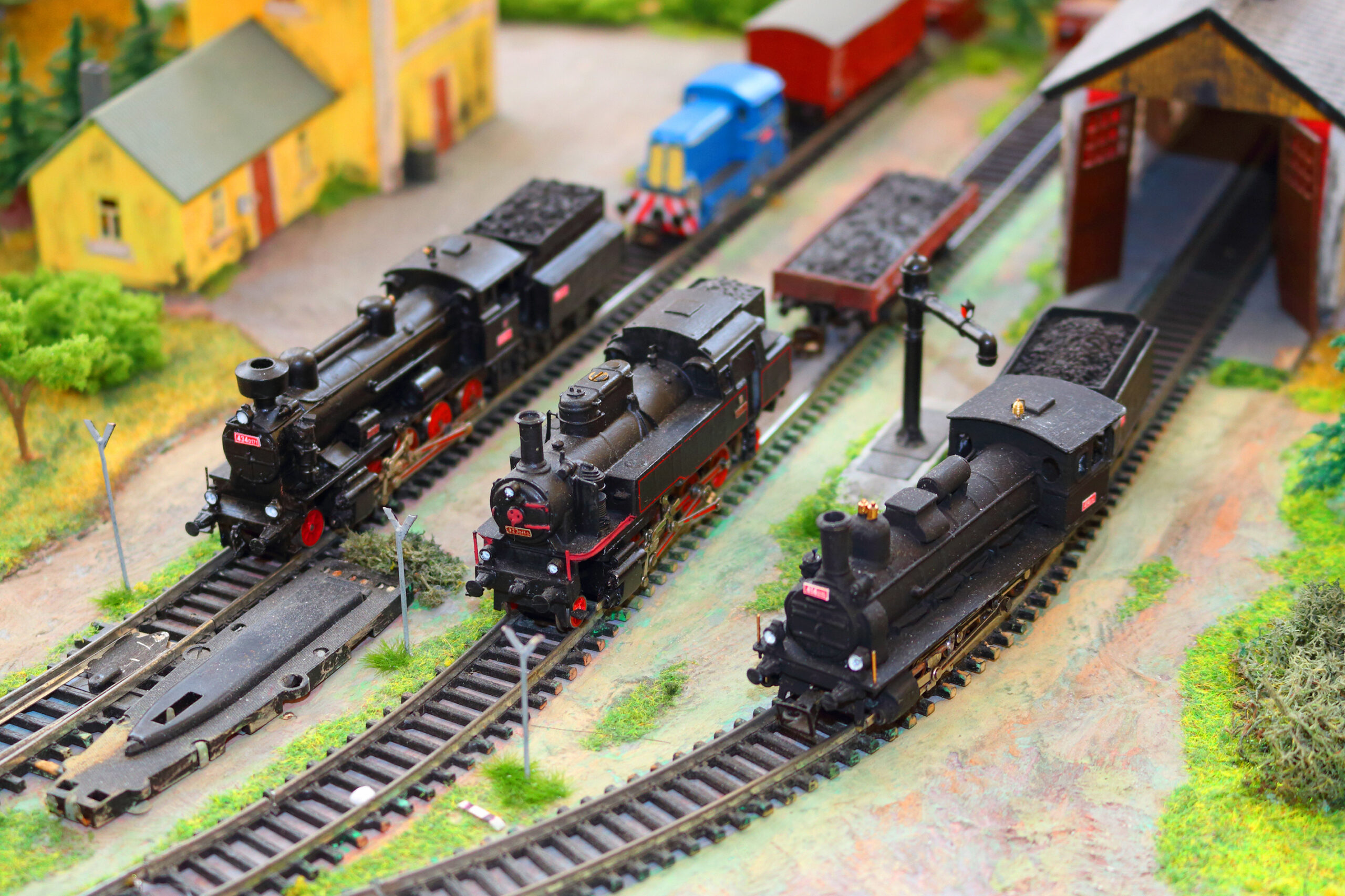 3 model trains on separate tracks